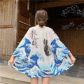 White kimono-style jacket with japanese wave print and fish prints inspired by hokusai for sun protection clothing
