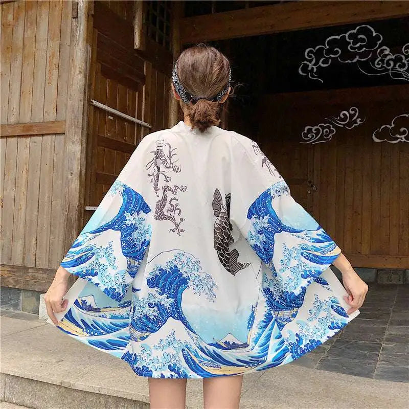 White kimono-style jacket with japanese wave print and fish prints inspired by hokusai for sun protection clothing