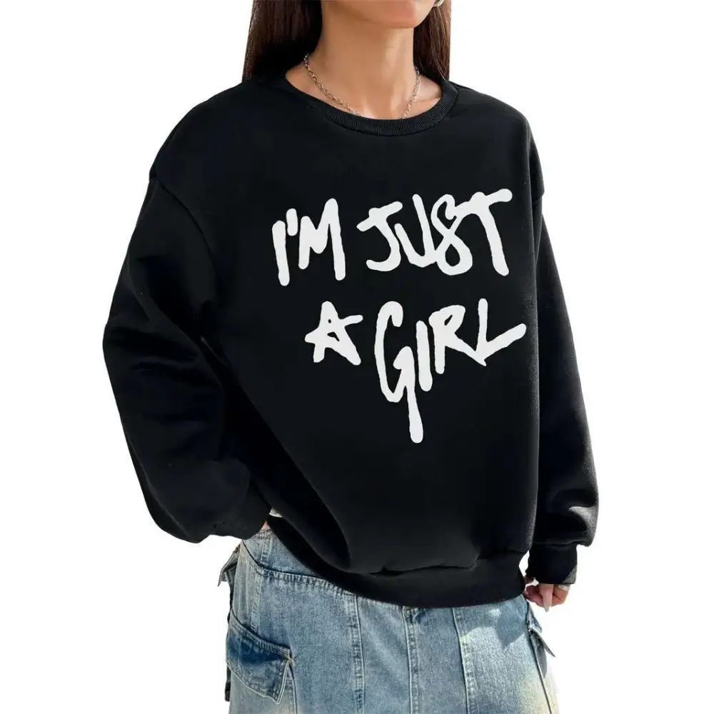 Black oversized sweatshirt with bold white girl print round crew neck and im just a girl text across the chest