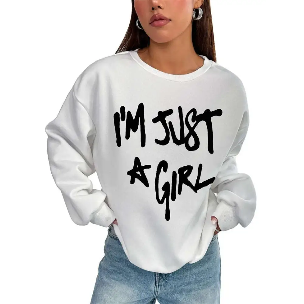 White oversized sweatshirt with bold black im just a girl handwritten text featuring a crew neck girl print round design