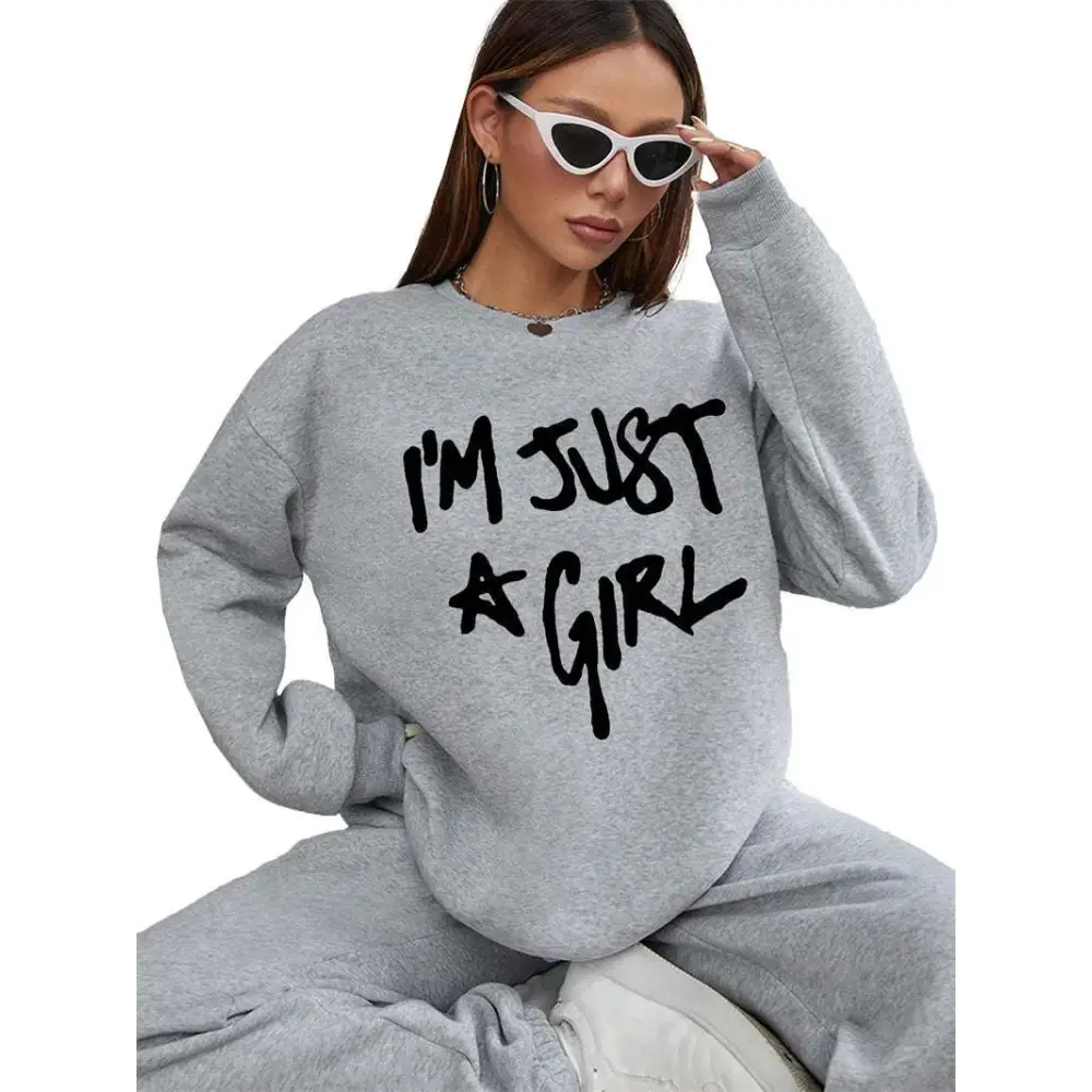 Gray oversized sweatshirt with black handwritten style girl print round neck text across the chest for casual wear