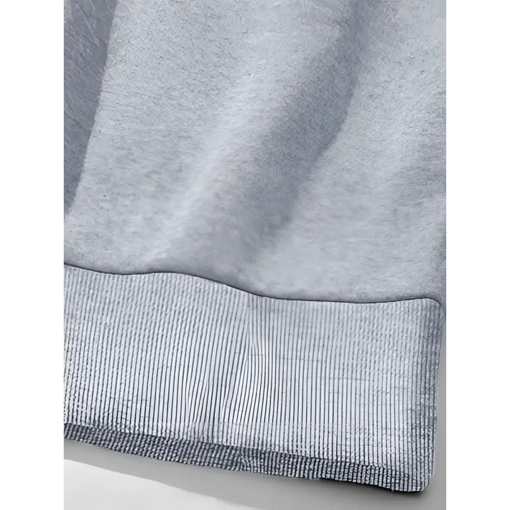 Gray heathered sweatshirt cuff with ribbed knit detailing on oversized sweatshirt with girl print round neck design