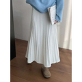 A flowing white korean elastic waist knitted pleated midi skirt made of soft lightweight fabric that drapes elegantly