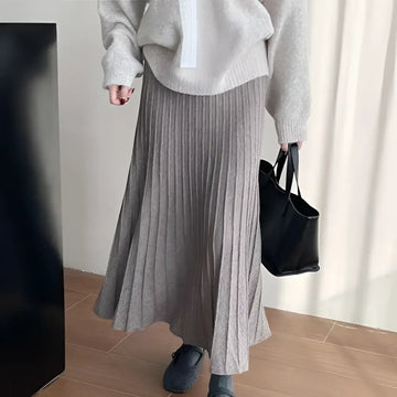 A soft heather gray korean elastic waist knitted pleated midi skirt with ribbed texture for comfortable wear