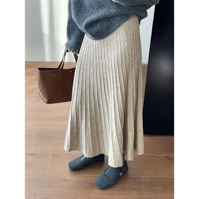 A soft heather gray korean elastic waist knitted pleated midi skirt with ribbed texture for comfortable wear