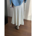 A flowing white korean elastic waist knitted pleated midi skirt made of soft lightweight fabric