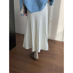 A flowing white korean elastic waist knitted pleated midi skirt made of soft lightweight fabric