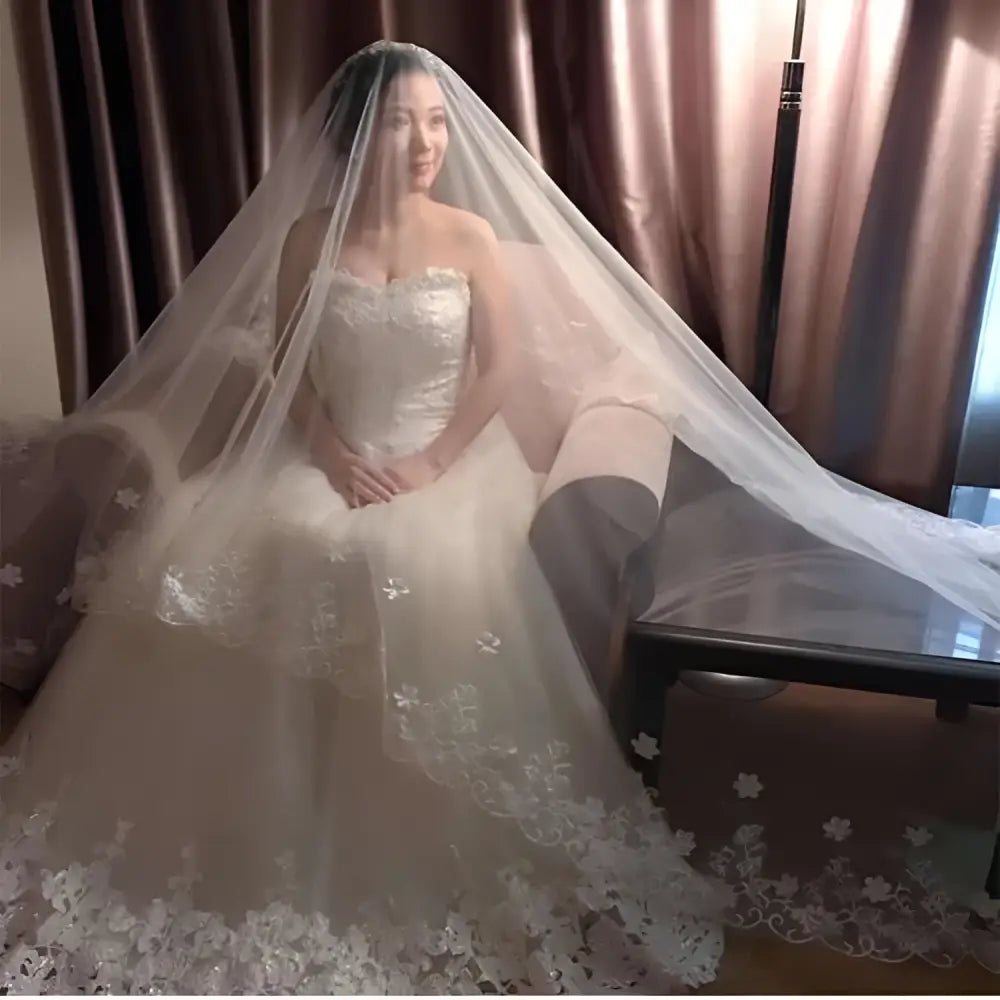 White korean lace petal bridal veil with delicate floral appliqués and sheer flowing design for weddings