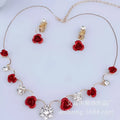 Red rose necklace featuring a bride red rose pendant with clear crystal accents on a korean small clear gold-tone chain