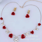 Red rose necklace featuring a bride red rose pendant with clear crystal accents on a korean small clear gold-tone chain