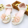 Cream-colored korean style flower princess sandals with peach fabric roses and white pearls accented by gold beads