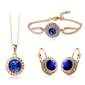 Korean style jewelry set featuring rose gold-toned silver with central deep blue crystal and smaller clear crystals