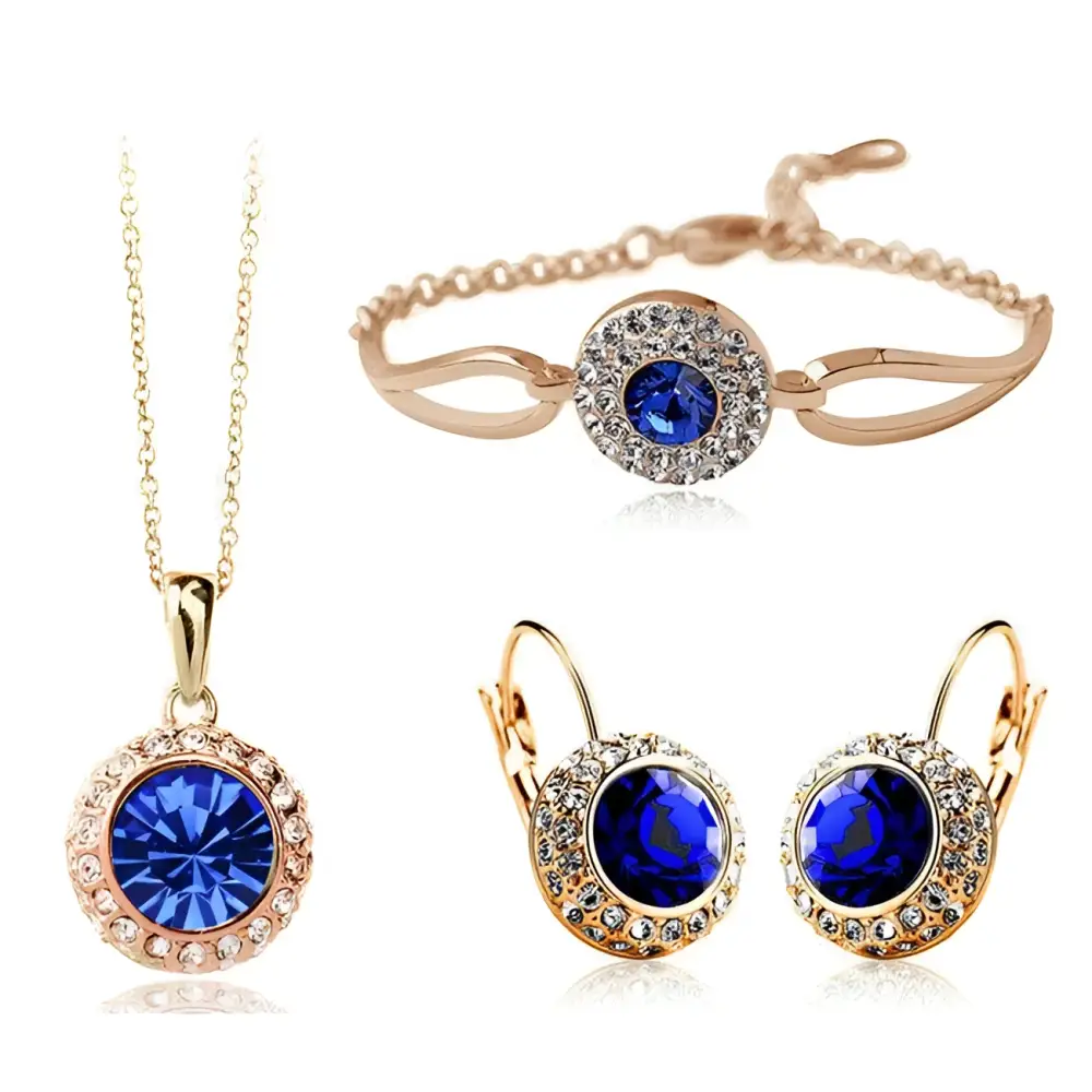Korean style jewelry set featuring rose gold-toned silver with central deep blue crystal and smaller clear crystals