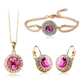 Rose gold toned korean style jewelry set featuring a pink crystal center surrounded by smaller clear crystals