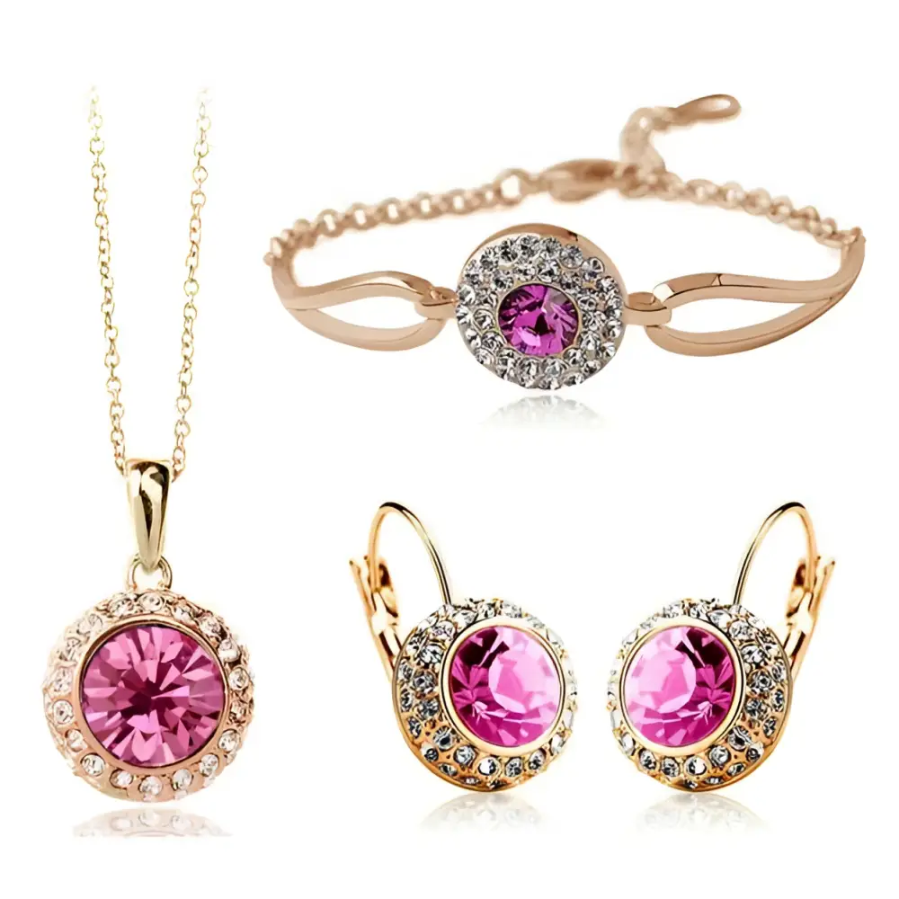 Rose gold toned korean style jewelry set featuring a pink crystal center surrounded by smaller clear crystals
