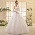 White Korean style lace wedding dress with strapless bodice paired with intricate beading and matching gloves