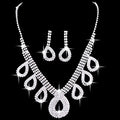 A silver rhinestone necklace set with teardrop pendant and matching earrings for korean wedding dress accessories jewelry