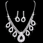 A silver rhinestone necklace set with teardrop pendant and matching earrings for korean wedding dress accessories jewelry