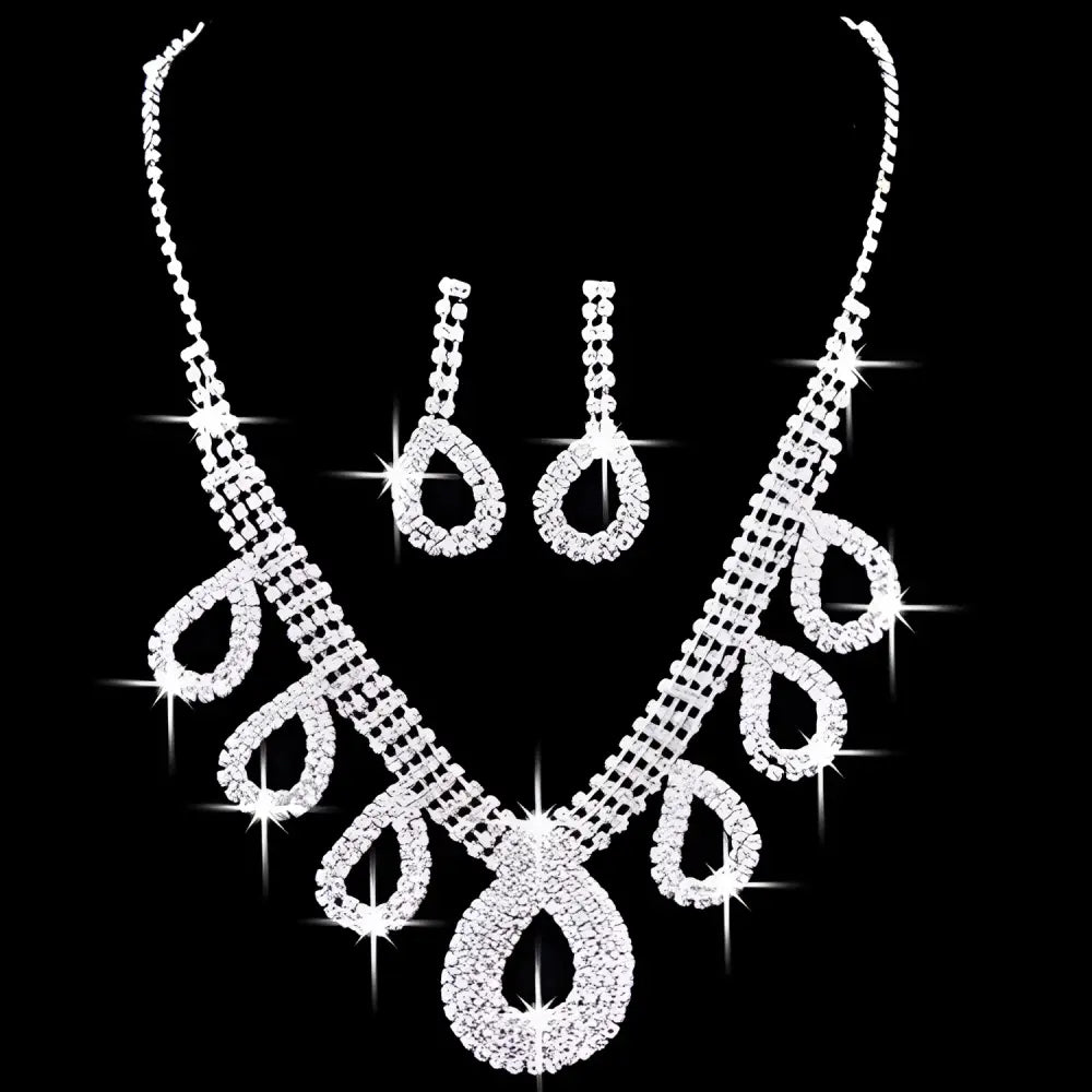 A silver rhinestone necklace set with teardrop pendant and matching earrings for korean wedding dress accessories jewelry