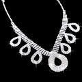 A korean wedding silver rhinestone necklace with intricate patterns and teardrop charms for dress accessories jewelry