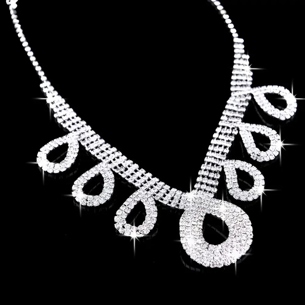A korean wedding silver rhinestone necklace with intricate patterns and teardrop charms for dress accessories jewelry