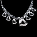 A sparkling silver rhinestone necklace with geometric beaded design and teardrop charms for Korean wedding dress accessories jewelry