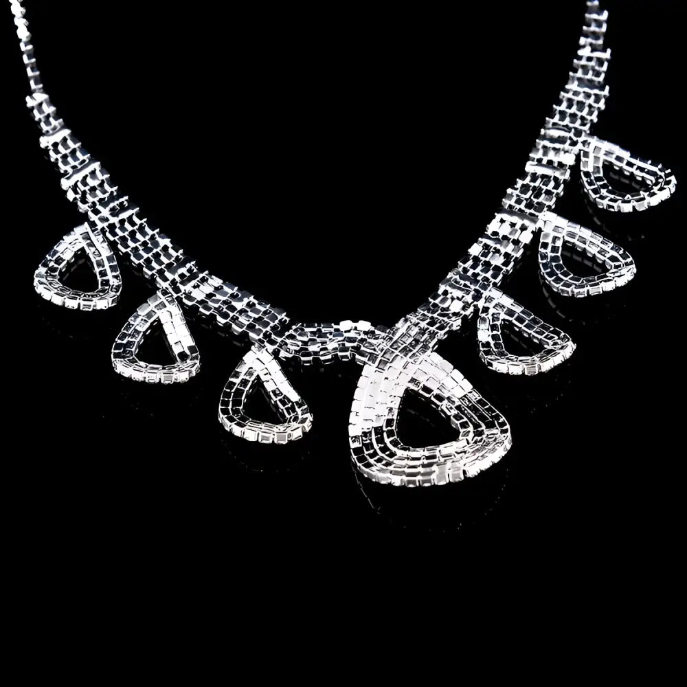 A sparkling silver rhinestone necklace with geometric beaded design and teardrop charms for Korean wedding dress accessories jewelry