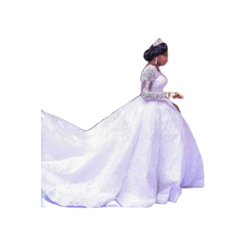 White lace african wedding dress with long sleeves and an elaborate train ideal for african wedding ceremonies
