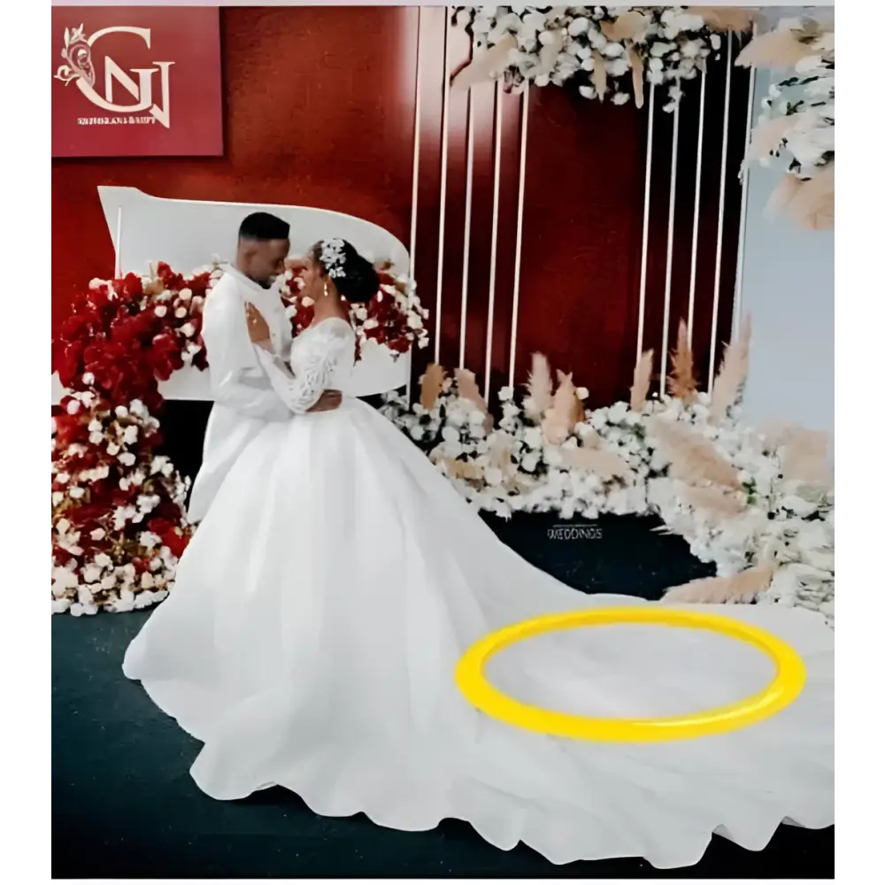Yellow circular ring on the white lace ball gown wedding dress long sleeves train back side view