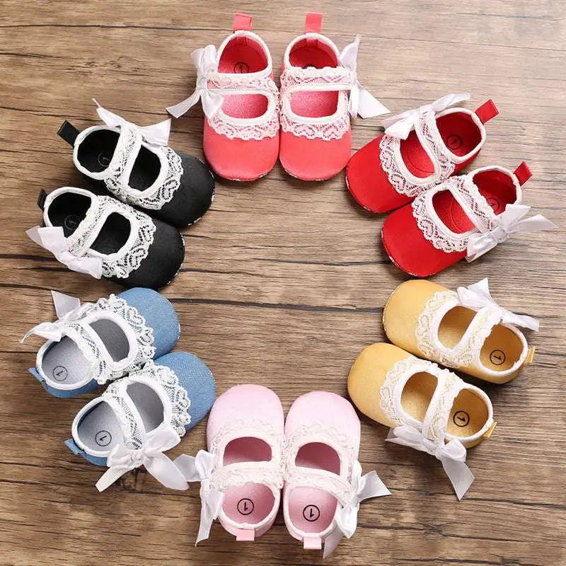 Cute baby toddler shoes in pink red black blue and yellow with white lace trim and bows lace bow princess design