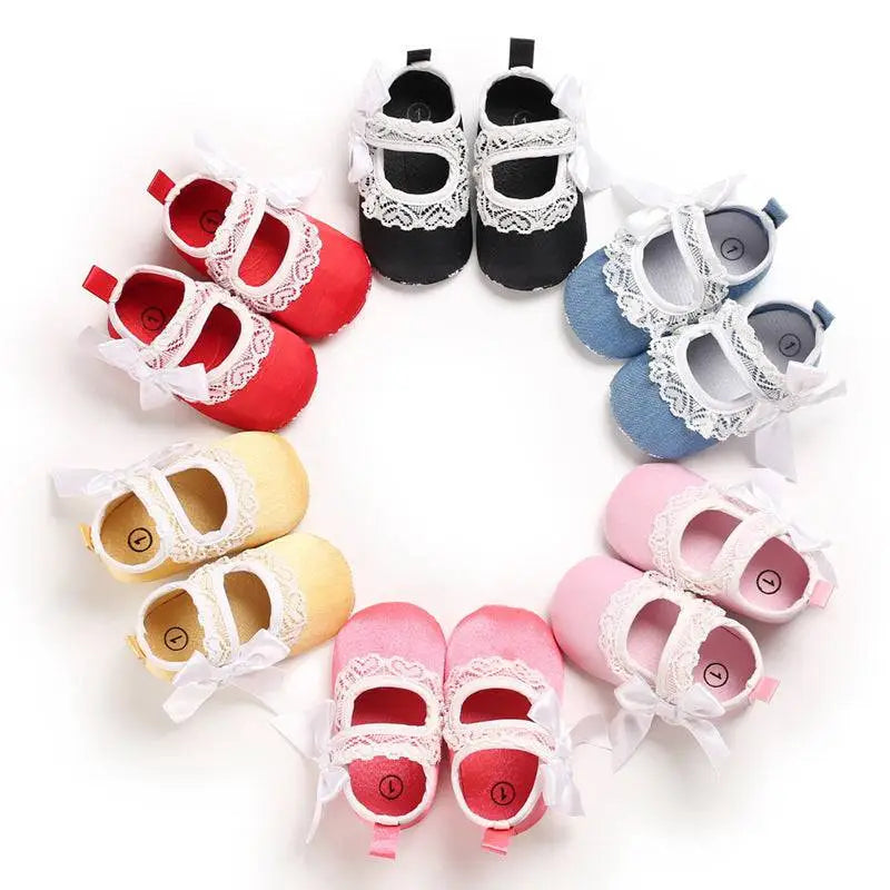 A set of lace bow princess shoes baby in red black blue yellow and pink with white lace trim and matching bow