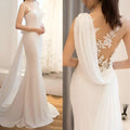 White lace mermaid super fairy light wedding dress with intricate lace back and sheer fabric draped over one shoulder