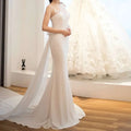 White lace mermaid wedding gown with fitted bodice and flowing train from lace mermaid super fairy light wedding collection
