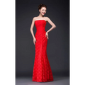 A vibrant fuchsia lace mermaid wedding dress with a fitted bodice made of intricate lace fabric