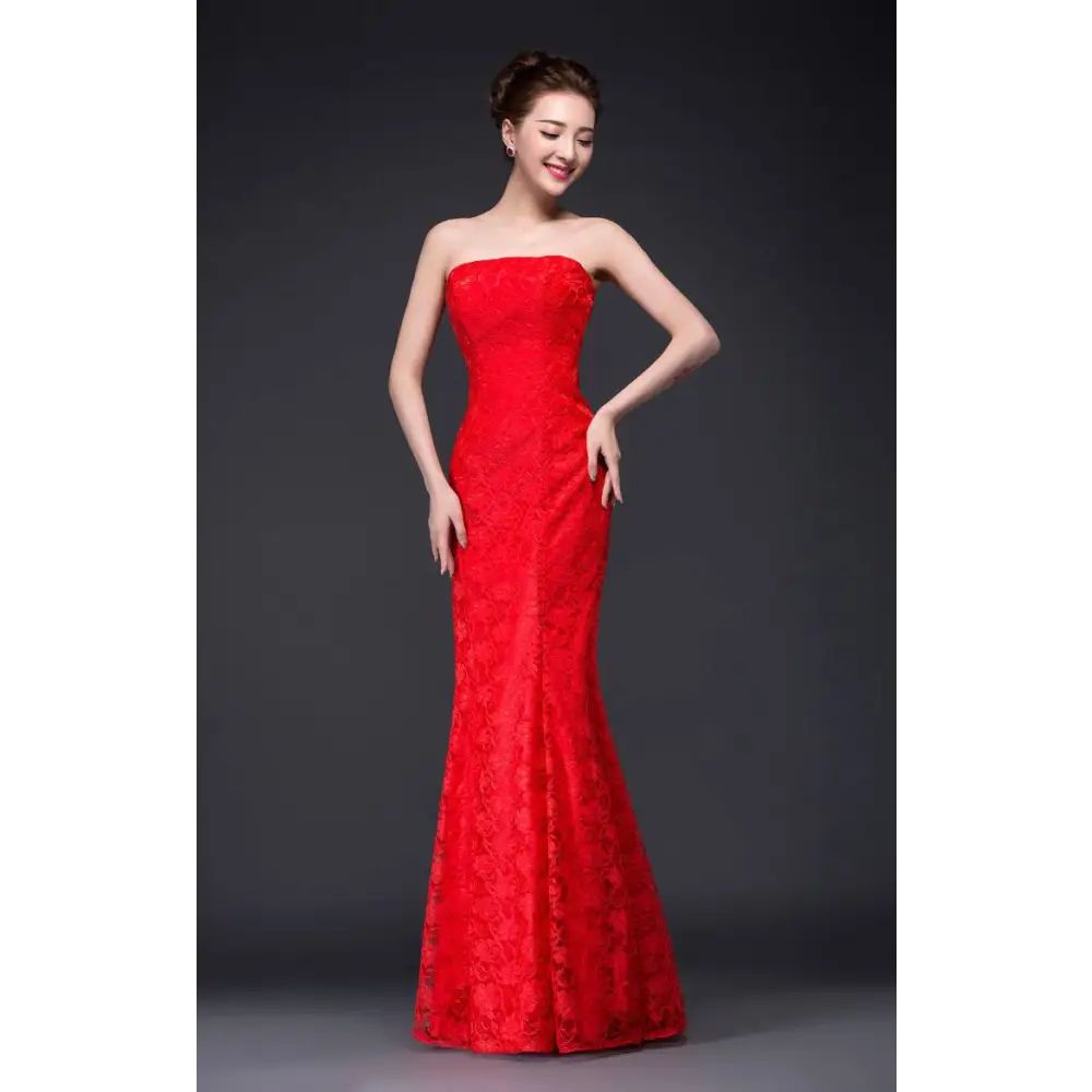 A vibrant fuchsia lace mermaid wedding dress with a fitted bodice made of intricate lace fabric