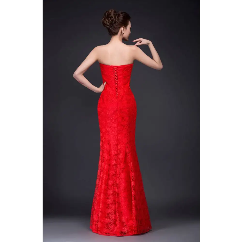 A vibrant red lace mermaid wedding dress fuchsia with a fitted bodice and back zipper detail