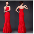 A vibrant red lace mermaid wedding dress fuchsia with strapless fitted bodice and intricate floral patterns