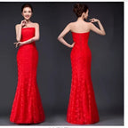 A vibrant red lace mermaid wedding dress fuchsia with strapless fitted bodice and intricate floral patterns