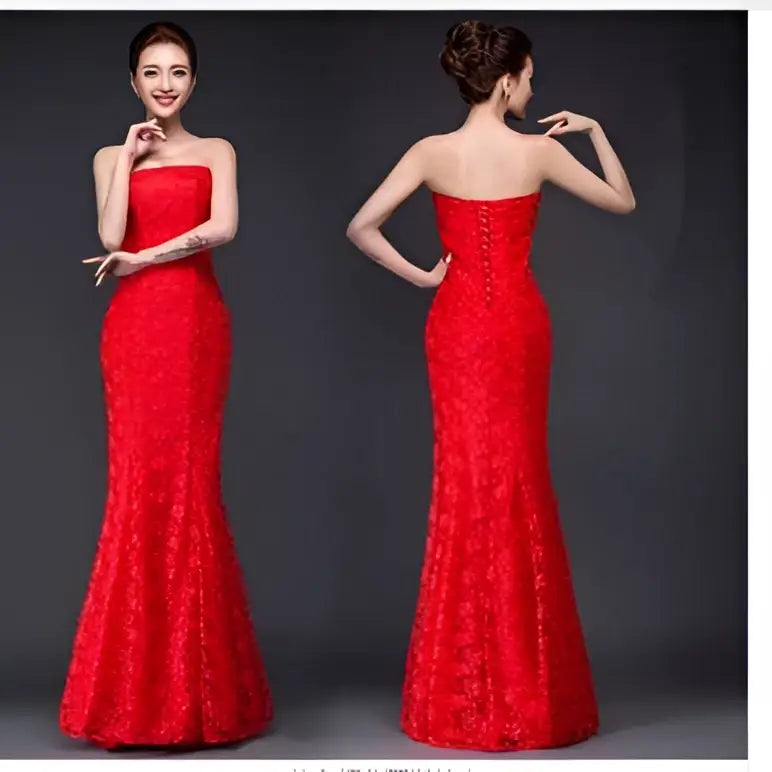 A vibrant red lace mermaid wedding dress fuchsia with strapless fitted bodice and intricate floral patterns