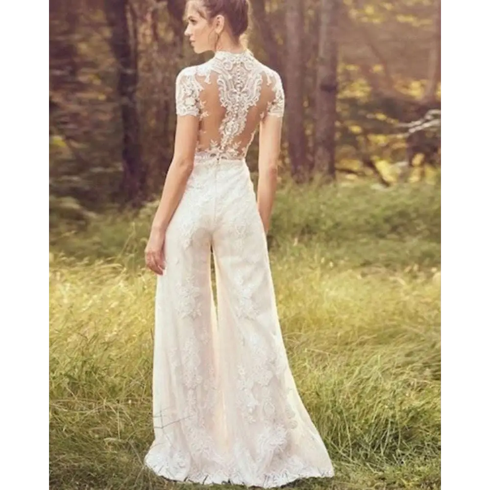 White lace bride pants suit with short sleeves and intricate floral embroidery on back and legs suit wedding jumpsuit