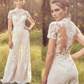 White lace bride pants suit with short sleeves high neckline and floral embroidery on back and sides suit wedding jumpsuit