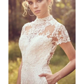 White lace bride pants suit with intricate floral embroidery and short sleeves for a suit wedding jumpsuit