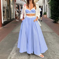 Light blue high-waisted pleated midi big swing skirt with subtle striped texture in lace splicing sling vest set