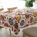 Vibrant linen table cloth with lace trim featuring sunflower cotton linen floral and paisley patterns on cream background