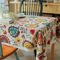 Beige lace trim sunflower cotton linen table cloth with vibrant floral and circular patterns in red blue yellow and brown