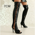Black patent leather knee boots with lace up detailing and peep toe design over the knee style