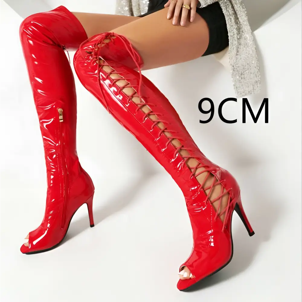 Vibrant red patent leather over-the-knee knee boots with lace-up detailing and peep-toe design for women