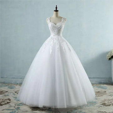 A white floor-length waist wedding dress featuring intricate lace v neck detailing on the bodice and skirt