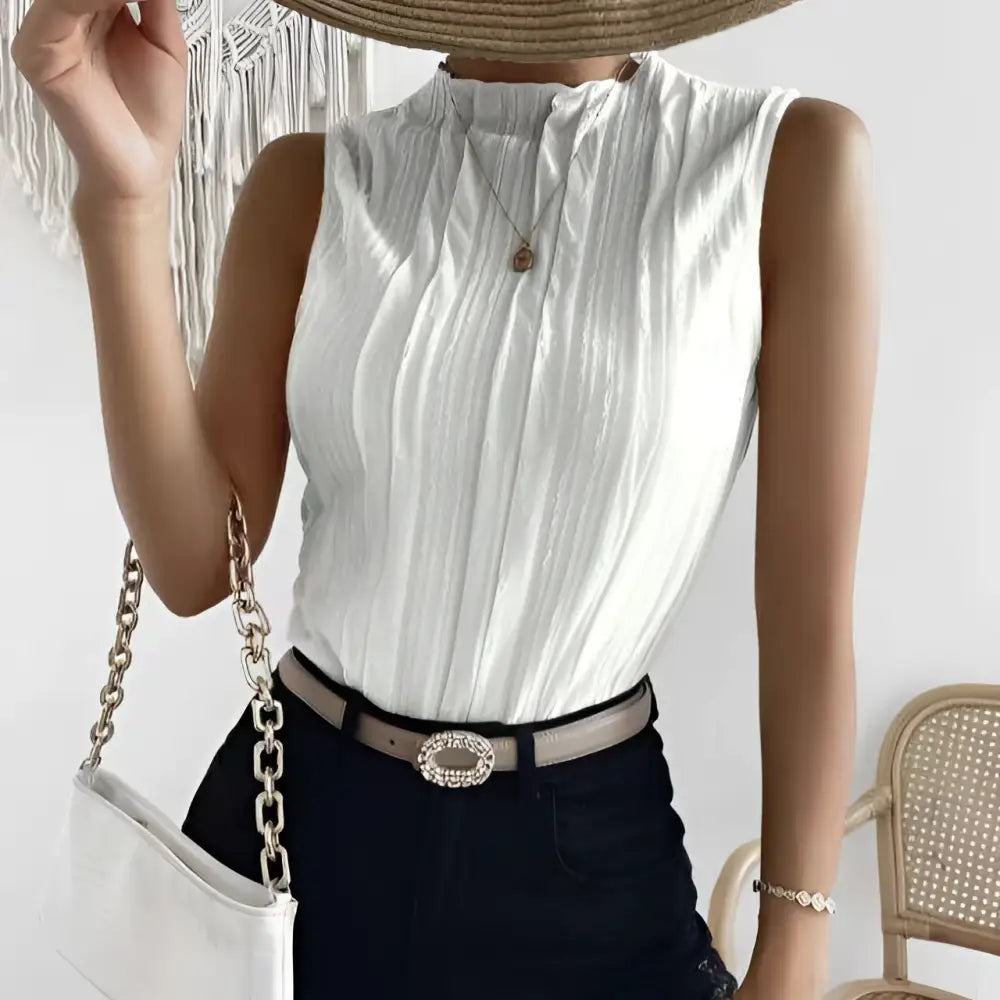 Ladies fashionable versatile white pleated vest top with high neckline and sleeveless design in lightweight fabric