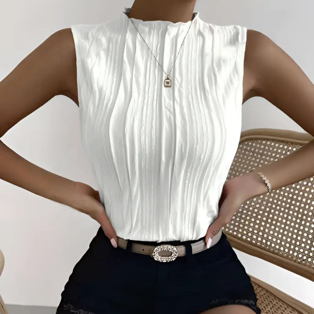 Ladies fashionable versatile white pleated vest top featuring a sleeveless design and high neckline for elegant wear